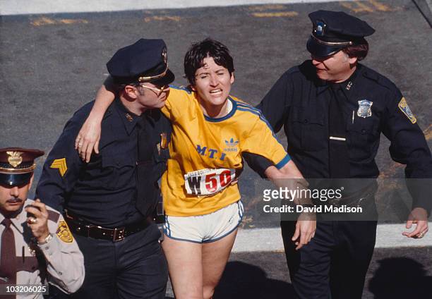 Rosie Ruiz is shown moments after crossing the finish line as the apparent women's race winner of the 84th Boston Marathon on April 21, 1980 in...