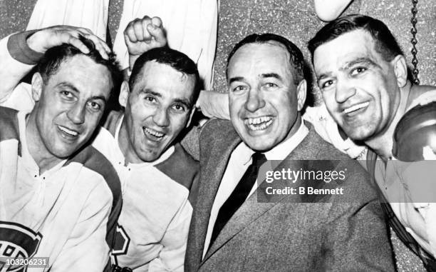 Jean Beliveau, Jacques Plante, head coach Toe Blake and Bernie Geoffrion of the Montreal Canadiens celebrate their last victory of the season against...