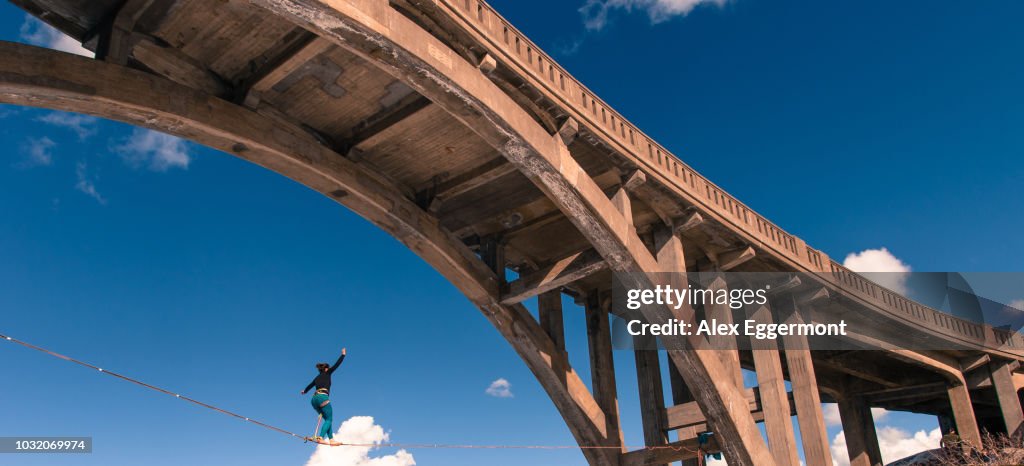 Woman highlining, Donner Pass, Truckee, California, USA