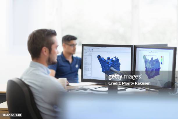 engineers designing gearboxes using computer aided design (cad) software in gearbox factory - engineer cad photos et images de collection