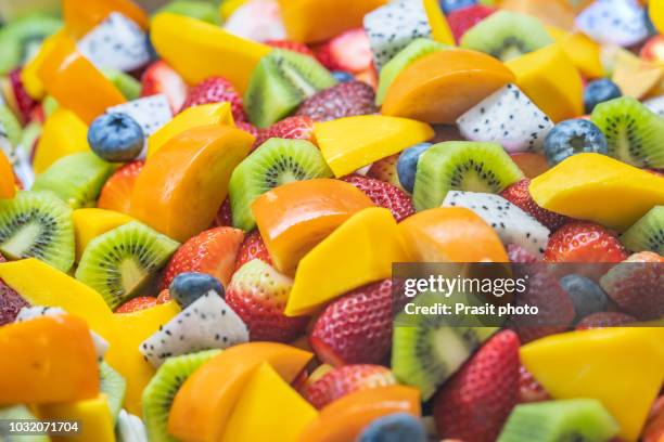 healthy fresh fruit salad on white background. top view.fruit background - fruit exotique photos et images de collection