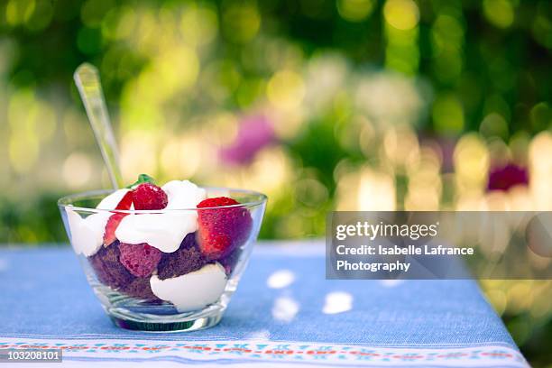 strawberries and whipped cream - strawberry and cream stock pictures, royalty-free photos & images