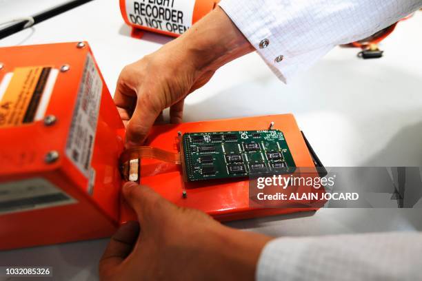 Researcher of the Office of Investigation and Analysis retrieves the data of a flight recorder, in the laboratory of the BEA headquarters, on...