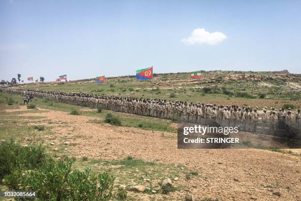 Eritrean soldiers wait in a line on September 11, 2018 to cross the border to attend the border reopening ceremony with Ethiopians as two land border...