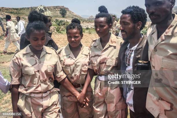 Eritrean soldiers react on September 11, 2018 in Serha, Eritrea, as two land border crossings between Ethiopia and Eritrea were reopened for the...