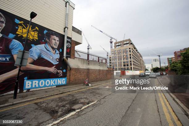 General view of a mural of Billy Bonds and Trevor Brooking which neighbours the newly constructed flats built in the place of the Chicken Run of...