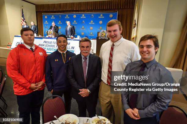 Mater Dei High's Kekaniokoa Gonzalez, left, Nikko Remigio, Coach Bruce Rollinson, Tommy Brown and Jack Genova during the 42nd Annual Football Press...