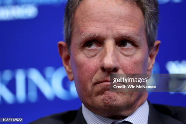 Former U.S. Treasury Secretary Timothy Geithner attends a conference with former Federal Reserve Board Chairman Ben Bernanke and former U.S. Treasury...