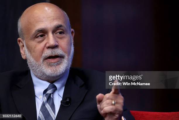 Former Federal Reserve Board Chairman Ben Bernanke answers questions at a conference with former U.S. Treasury Secretary Timothy Geithner and former...