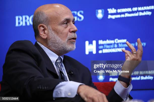 Former Federal Reserve Board Chairman Ben Bernanke answers questions at a conference with former U.S. Treasury Secretary Timothy Geithner and former...