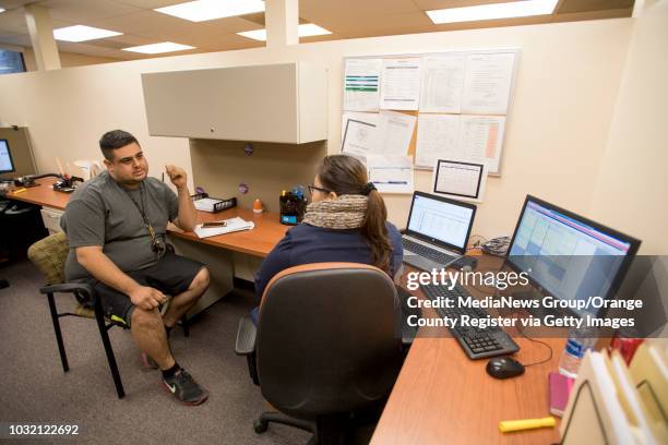 Ricardo Lozano, of Santa Ana, gets help signing up for Covered California from AltaMed patient care coordinator Lidia Hertado on the last day to sing...