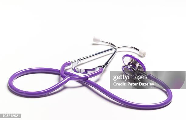 close up of purple stethoscope - stethoscope white background stock pictures, royalty-free photos & images