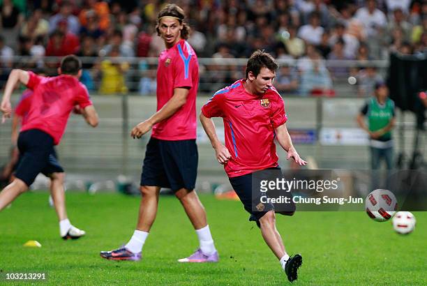 Lionel Messi and Zlatan Ibrahimovic of FC Barcelona attend during a training session at the Seoul Worldcup stadium on August 3, 2010 in Seoul, South...