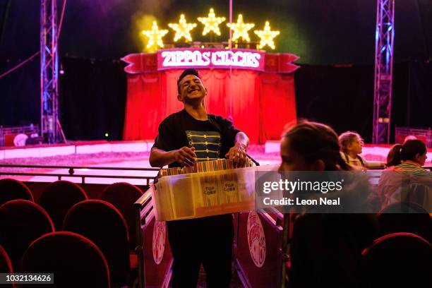 Victor Antunez of Argentina sells popcorn, ahead of a performance at Zippo's circus in Victoria Park on June 13, 2018 in Glasgow, Scotland. As the...