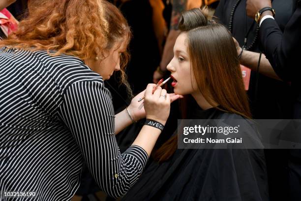 Model prepares backstage for Calvin Luo during New York Fashion Week: The Shows at Gallery I at Spring Studios on September 12, 2018 in New York City.
