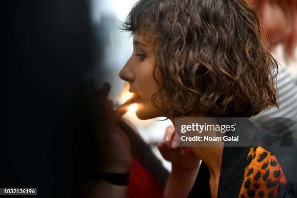 Model prepares backstage for Calvin Luo during New York Fashion Week: The Shows at Gallery I at Spring Studios on September 12, 2018 in New York City.