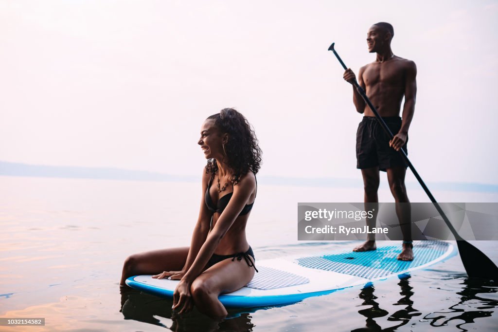 Young Couple Paddleboarding Puget Sound in Summer