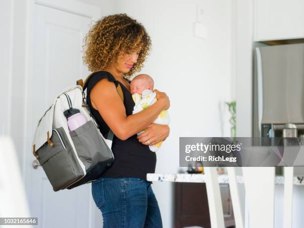 mom and newborn baby in a home - baby bag stock pictures, royalty-free photos & images