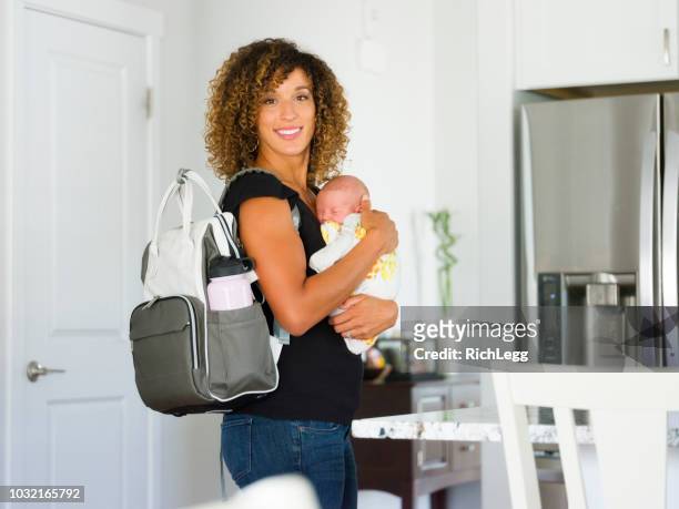 mom and newborn baby in a home - diaper bag stock pictures, royalty-free photos & images