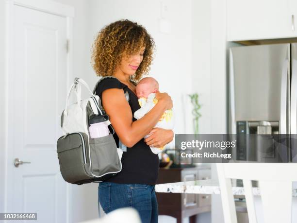 mom and newborn baby in a home - diaper bag stock pictures, royalty-free photos & images