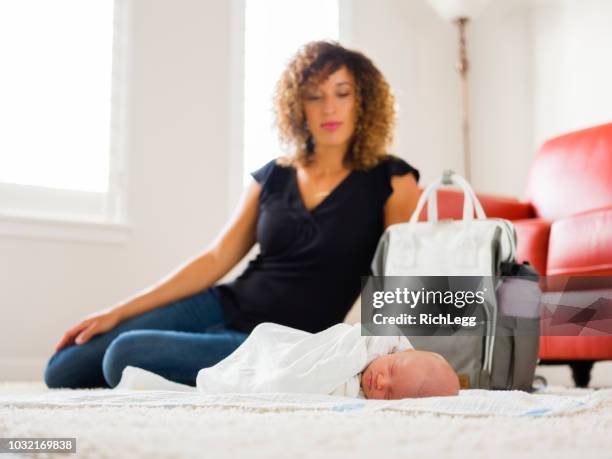 mom and newborn baby in a home - diaper bag stock pictures, royalty-free photos & images
