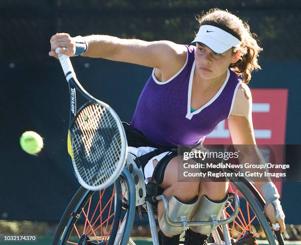 Marjolein Buis, of the Netherlands, hits the ball during her doubles semi-final match with partner Michaela Spaanstra in the UNIQLO Wheelchair Tennis...