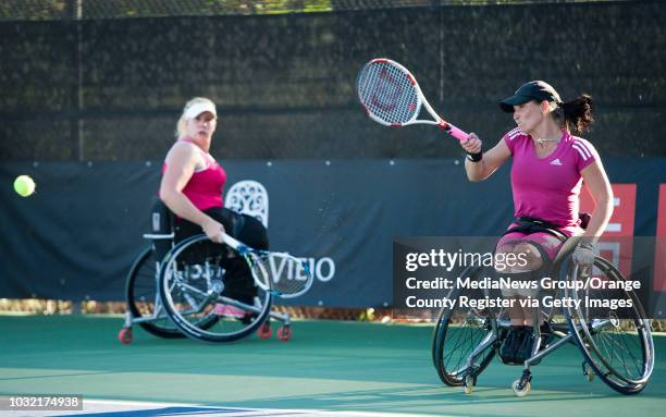 Katharina Kruger, of Germany, hits the ball during her doubles semi-finals match with partner Louise Hunt during the UNIQLO Wheelchair Tennis Doubles...