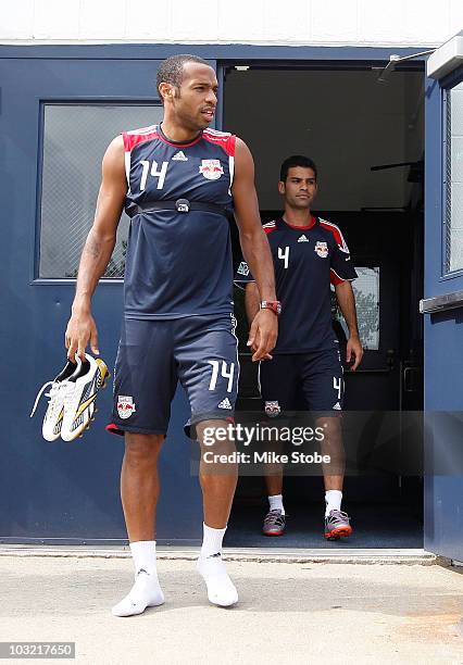 Rafa Marquez and Thierry Henry of the New York Red Bulls arrive for practice at Montclair State University on August 3, 2010 in Montclair, New Jersey.