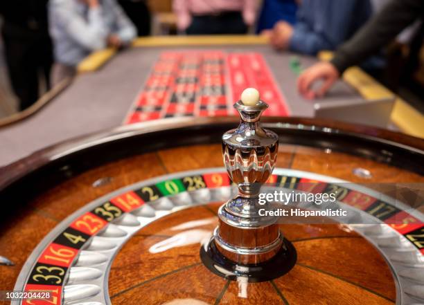 close up of roulette wheel at the casino - casino tables hands stock pictures, royalty-free photos & images