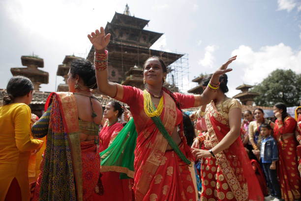 Nepalese Hindu women sing and dance during the Teej festival in Kathmandu, Nepal, September 12, 2018. Teej festival, celebrated by Hindu women in...
