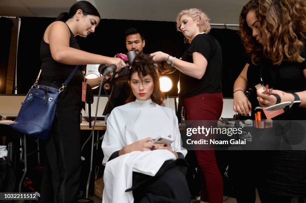 Model prepares backstage for Calvin Luo during New York Fashion Week: The Shows at Gallery I at Spring Studios on September 12, 2018 in New York City.