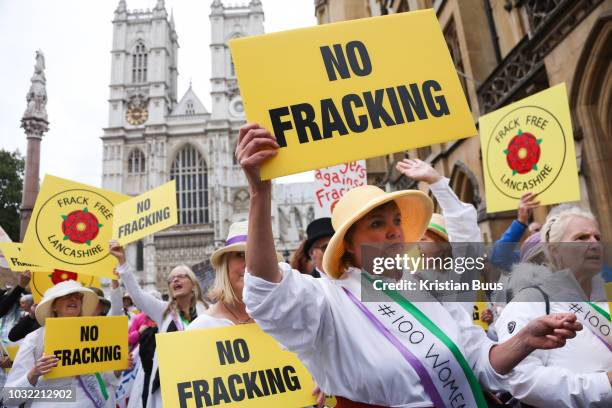 Up to a hundred women from the Lancashire anti-fracking movement dressed as suffragettes congregate in Parliament Square and pay the Dep For Energy,...