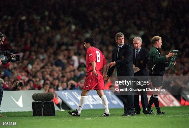 Wales manager Mark Hughes substitutes Dean Saunders during the International Friendly match against Brazil at the Millennium Stadium in Cardiff,...