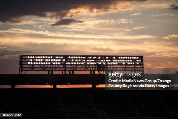 The sun sets behind the lights during the Angels' 4-2 loss to the Houston Astros at Angel Stadium on Monday. ///ADDITIONAL INFO: angels.0628.kjs ---...