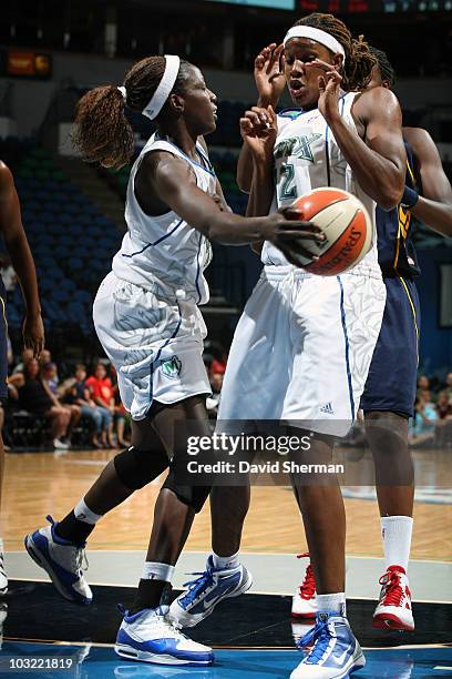 Hamchetou Maiga-Ba of the Minnesota Lynx passes around teammate Rebekkah Brunson during the game against the Connecticut Sun on August 3, 2010 at the...