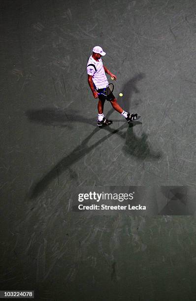 Andy Roddick of the USA walks up to serve against Grega Zemlja of Slovenia during day 2 of the Legg Mason Tennis Classic at the William H.G....