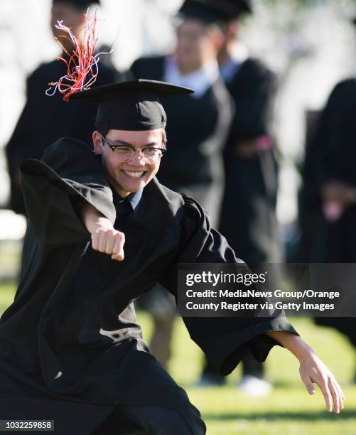 Graduate Travis Thai dances his way across the field during the Los Amigos High School Graduation at Bolsa Grande Stadium in Garden Grove, CA on...