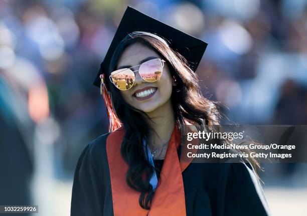 Graduate smiles during the Los Amigos High School Graduation at Bolsa Grande Stadium in Garden Grove, CA on Tuesday, June 20, 2017.