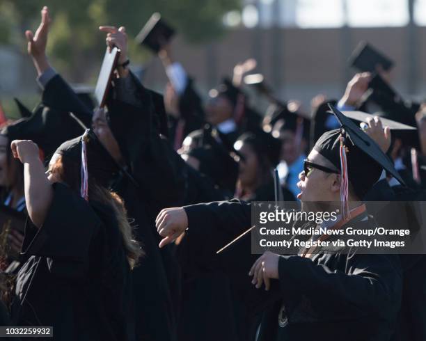 Graduate Parker Nguyen celebrates during the Los Amigos High School Graduation at Bolsa Grande Stadium in Garden Grove, CA on Tuesday, June 20, 2017.