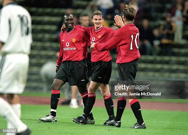 Ole Gunnar Solskjaer of Manchester United celebrates his goal with team mates Dwight Yorke and Teddy Sheringham during the pre-season Bayern Munich...