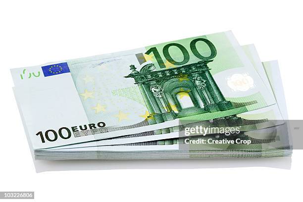 bundle of european 100 euro notes - bundle stock-fotos und bilder