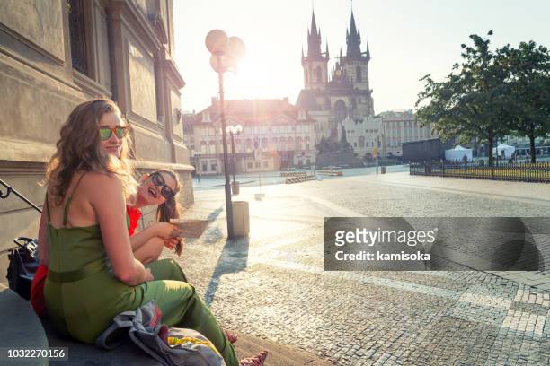 portrait of of best girlfriends on vacation in front of tyn church - prague people stock pictures, royalty-free photos & images