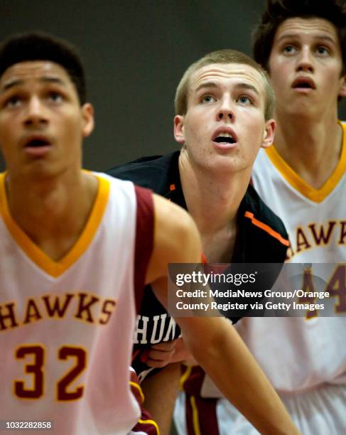 Huntington Beach basketball player Harley Ruder, center, watches the basket in a game against Westminster in the 2012 Charlie Wilkins Memorial...