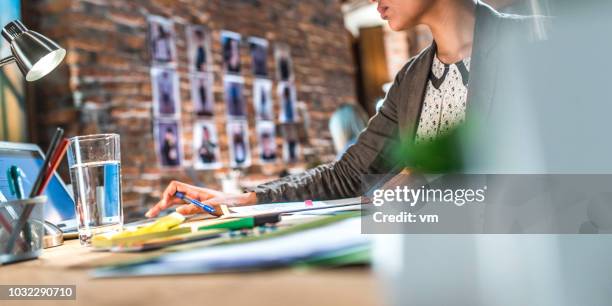 young woman in the office - graphic design studio stock pictures, royalty-free photos & images