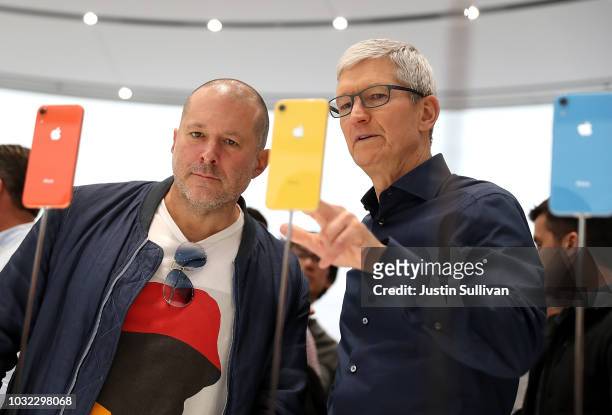 Apple chief design officer Jony Ive and Apple CEO Tim Cook inspect the new iPhone XR during an Apple special event at the Steve Jobs Theatre on...