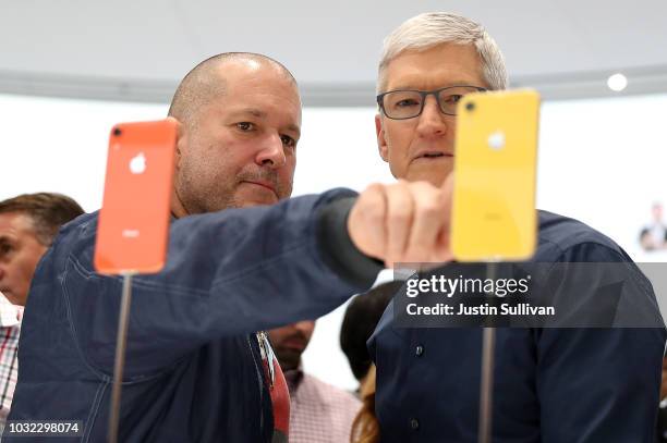 Apple chief design officer Jony Ive and Apple CEO Tim Cook inspect the new iPhone XR during an Apple special event at the Steve Jobs Theatre on...