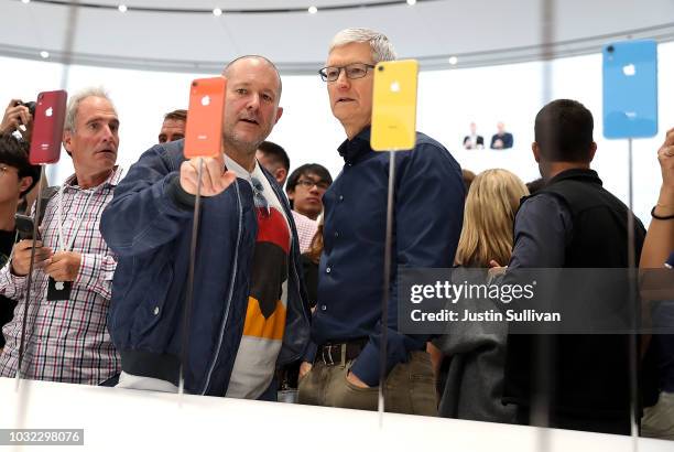 Apple chief design officer Jony Ive and Apple CEO Tim Cook inspect the new iPhone X R during an Apple special event at the Steve Jobs Theatre on...