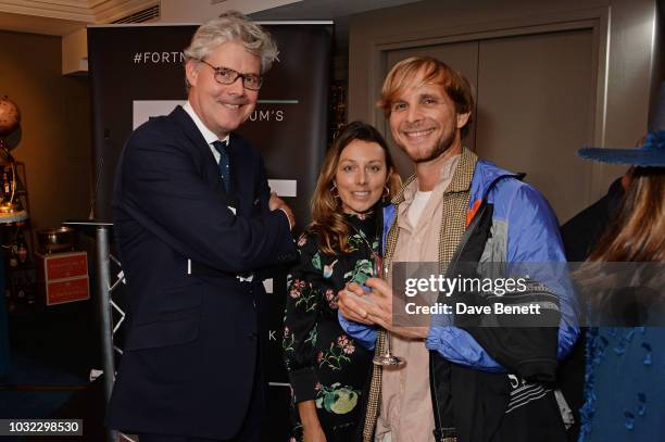 Michael Hue-Williams, Daniella Pickup and Christopher de Vos attend a drinks reception to celebrate the launch of the third annual Fortnum's x Frank...