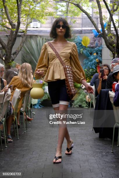 Model walks for the Staud Presentation during New York Fashion Week: The Shows at Laudree on September 12, 2018 in New York City.