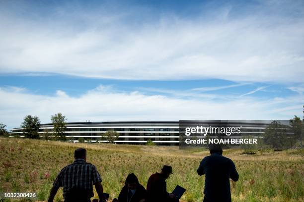 Journalists gather for a product launch event at Apple headquarters in Cupertino, California, on September 12, 2018. - New iPhones set to be unveiled...